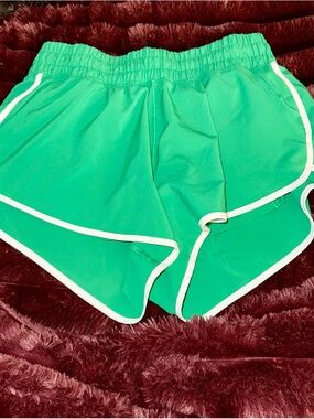 aerie off-line Green Athletic Shorts with White Trim and biker shorts underneath